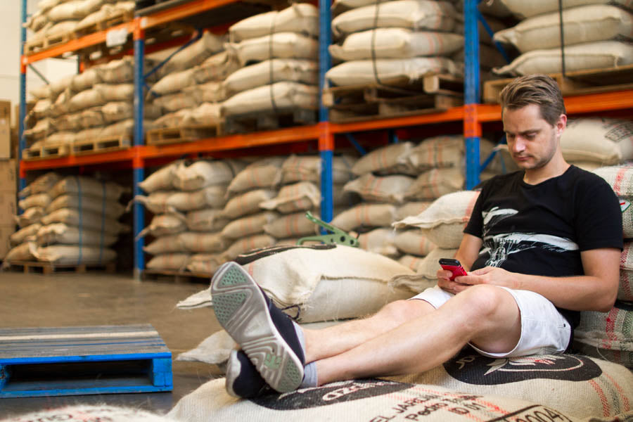 Richard sitting on coffee bean bags